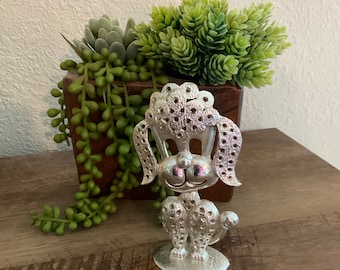 Zilverkleurige poedeloorbelhouder vintage retro