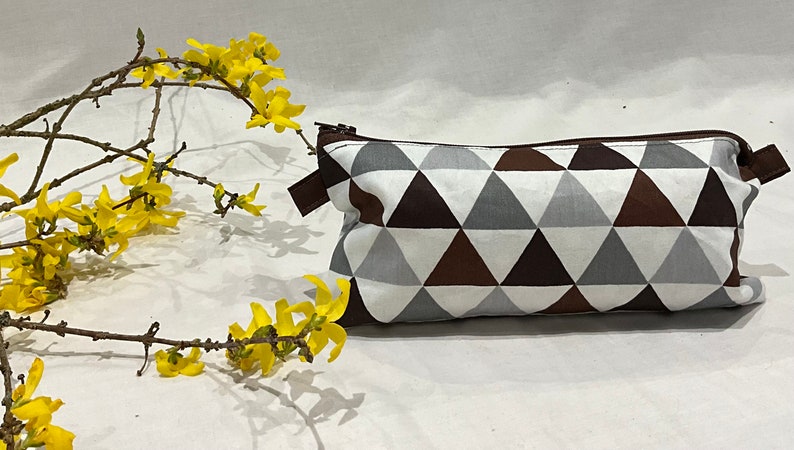 Handmade bags that can be used for anything you wish to keep together,so that you dont loose them, and can be easily sourced and organised. geometric