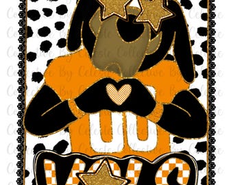May include: A graphic design featuring a cartoon dog wearing star-shaped sunglasses and an orange jersey with the number "UU". The word "VOLS" is displayed in a stylized font with a star accent. The background has a dalmatian pattern.