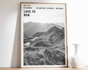 May include: A black and white photo of a person running on a mountain trail. The photo is framed in a wooden frame and has the text "LOVE TO RUN" and "#BORNTORUN" printed on it.