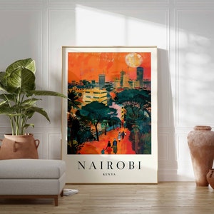 May include: A framed art print of Nairobi, Kenya, featuring a vibrant cityscape under an orange sky with a large moon. The artwork depicts buildings, trees, and figures walking on a path, with the city name and country at the bottom.