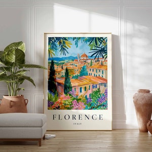 K&ouml;nnte beinhalten: Eine farbenfrohe Illustration der Stadt Florenz, Italien, mit Blick auf den Dom und die umliegenden Geb&auml;ude. Die Illustration ist in Gold gerahmt und tr&auml;gt den Text "FLORENZ ITALIEN" am unteren Rand.