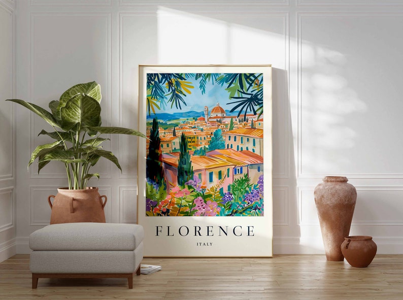 K&ouml;nnte beinhalten: Eine farbenfrohe Illustration der Stadt Florenz, Italien, mit Blick auf den Dom und die umliegenden Geb&auml;ude. Die Illustration ist in Gold gerahmt und tr&auml;gt den Text "FLORENZ ITALIEN" am unteren Rand.