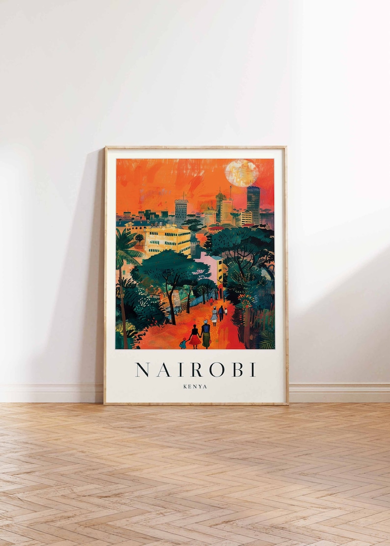 May include: Framed art print of Nairobi, Kenya, featuring a vibrant cityscape under an orange sky with a full moon. The artwork depicts buildings, trees, and people walking on a path, with the city name and country below.