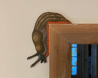 Hand painted MID-SIZED slug to sit on a door frame.