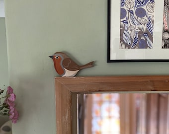 Hand painted robin for sitting on a door frame, picture rail, or similar