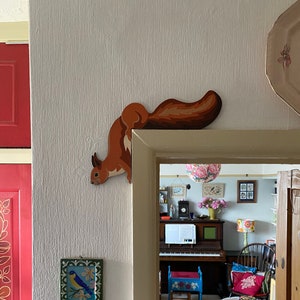 Hand painted squirrel to sit on a door frame