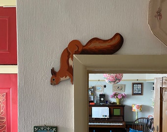 Hand painted red squirrel to sit on a door frame