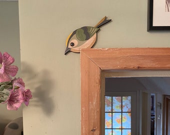 Hand painted goldcrest to sit on a door frame