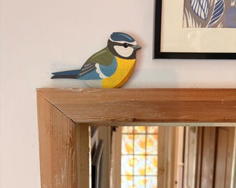 Hand painted blue tit to sit on a door frame, picture rail, dado rail etc.