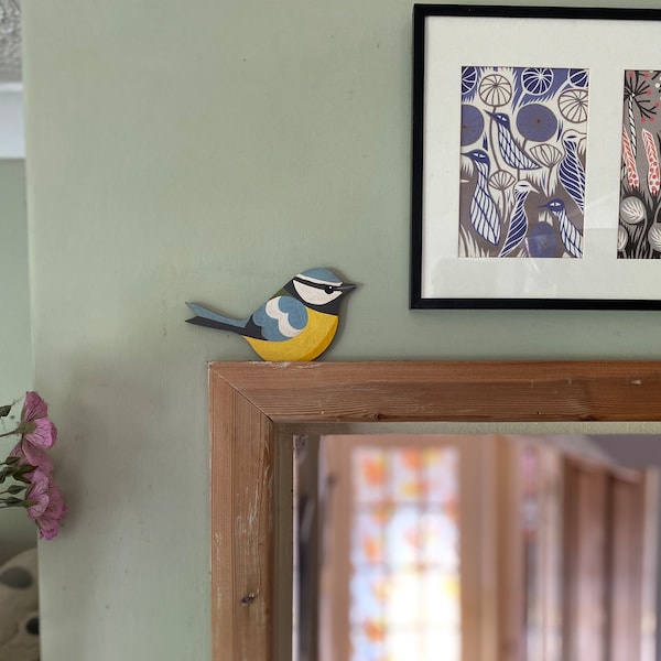 Hand painted blue tit for sitting on a door frame, picture rail or similar.