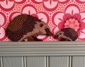 Hand painted hedgehog to sit on a door frame, picture rail or similar