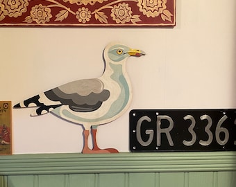 Hand painted herring gull to sit on a door frame, picture rail or similar.