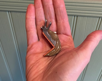 Hand painted miniature slug to sit on a door frame, light switch, or any corner in your house.