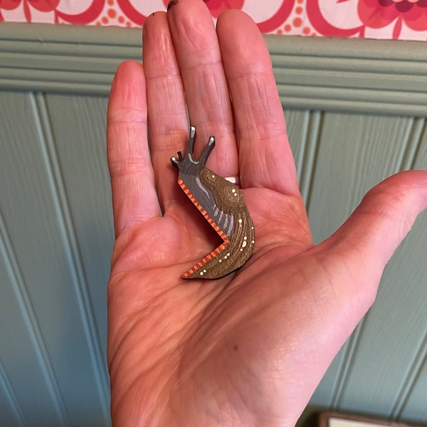 Hand painted miniature slug to sit on a door frame, light switch, or any corner in your house.