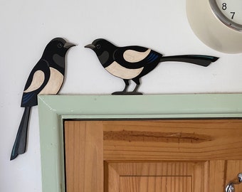 Hand painted magpie pair to sit on top of a door frame