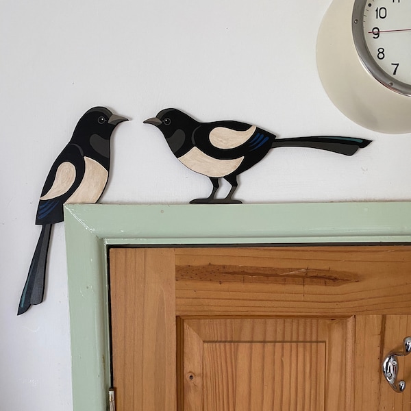 Hand painted magpie pair to sit on top of a door frame