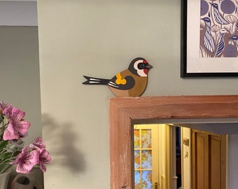 Hand painted goldfinch for sitting on a door frame, picture rail, or bookshelf etc