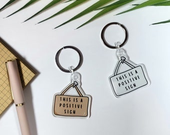 This is a Positive Sign Keychain | Cute, Funny Pun, Positive Message