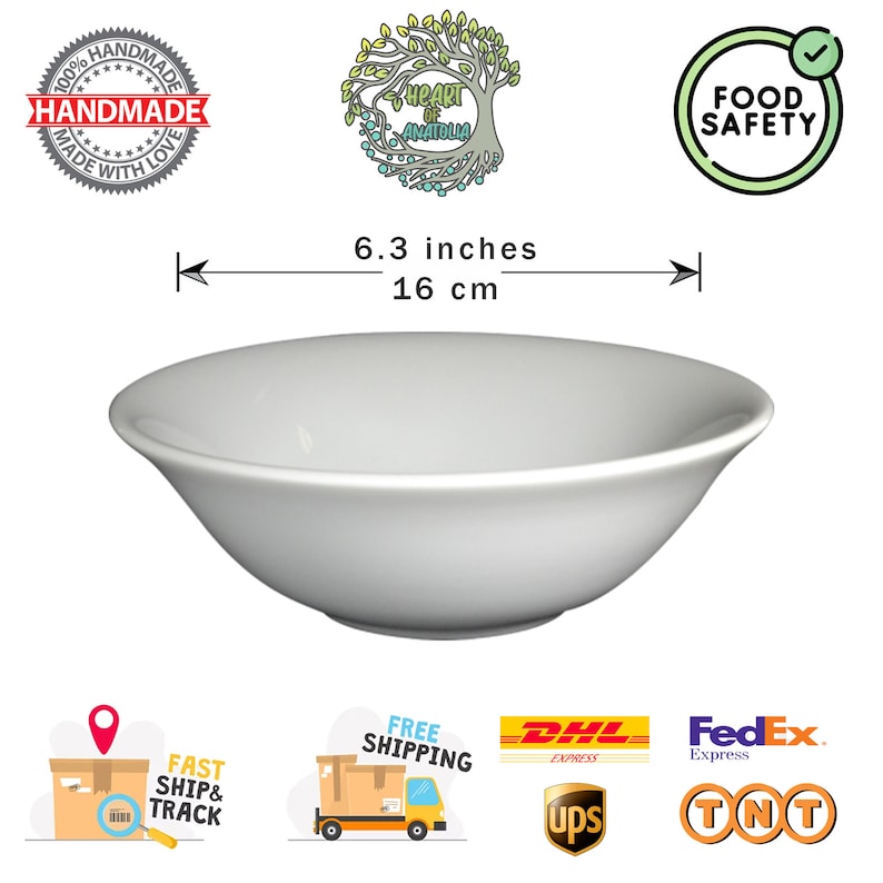May include: A white ceramic bowl, 6.3 inches (16 cm) in diameter, with a gently curved rim. The bowl is labeled "Food Safety" and "Handmade with Love".