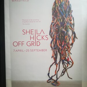 May include: A colourful, abstract sculpture made of woven strands of fabric. The sculpture is titled "Sheila Hicks Off Grid" and is on display at The Hepworth Wakefield from 7 April to 25 September.