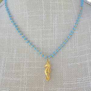 Gold seahorse charm blue bead necklace. Ocean sea life charm pendant summer beach lightweight enamel beaded chain Sweet beach vibes necklace