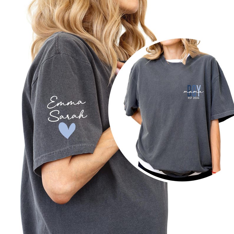 A woman wearing a gray t-shirt with the name "Emma Sarah" and the year "EST 2026" printed on it.