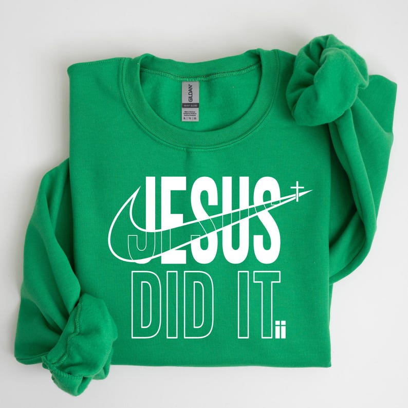 A green sweatshirt with the text "JESUS DID IT" printed on it.