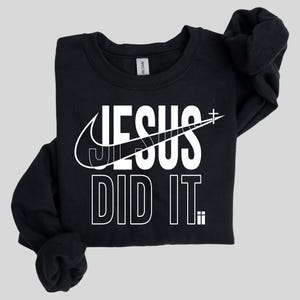 A black sweatshirt with a white graphic design on it.