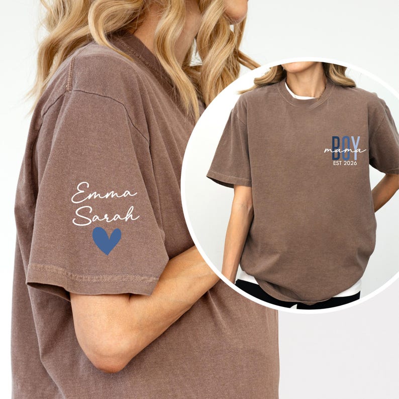 A woman wearing a brown t-shirt with a name and a heart symbol printed on it.