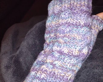 Hand knitted wrist warmers.