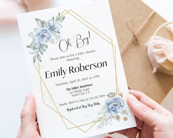May include: A blue and gold baby shower invitation with a geometric frame and floral accents. The text reads "Oh Boy!" and "Emily Roberson".