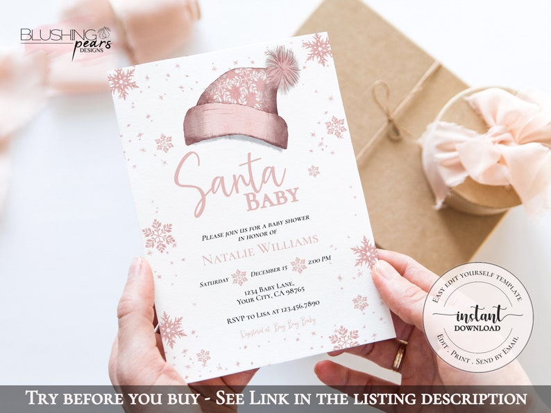 Op de afbeelding: Roze en witte babyborrel uitnodiging met sneeuwvlokken en glitter. De uitnodiging luidt "Santa Baby" en bevat de tekst "Kom gezellig langs voor een babyborrel ter ere van Natalie Williams".