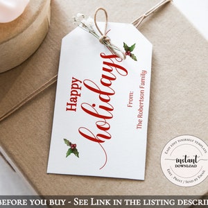 May include: A white gift tag with the words "Happy holidays" in red script, accented with holly illustrations. The tag includes "From: The Robertson Family" and is tied with twine to a wrapped gift.