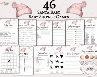 May include: A set of 10 printable baby shower game cards with a pink and white winter theme. The cards feature a pink and white Santa hat with snowflakes. The games include Baby Trivia, Finish the Nursery Rhyme Game, Baby Word Scramble, Scattergories, Baby Memory Game, Baby Around the World, Baby Bingo, Baby ABC, Cartoon Moms, Animal Pictionary, Baby Bucket List, and Baby Bump or Beer Belly?