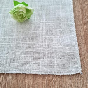 Tappetino in lino per composizioni fotografiche in piano: accessorio per lo styling e sfondo per matrimoni.