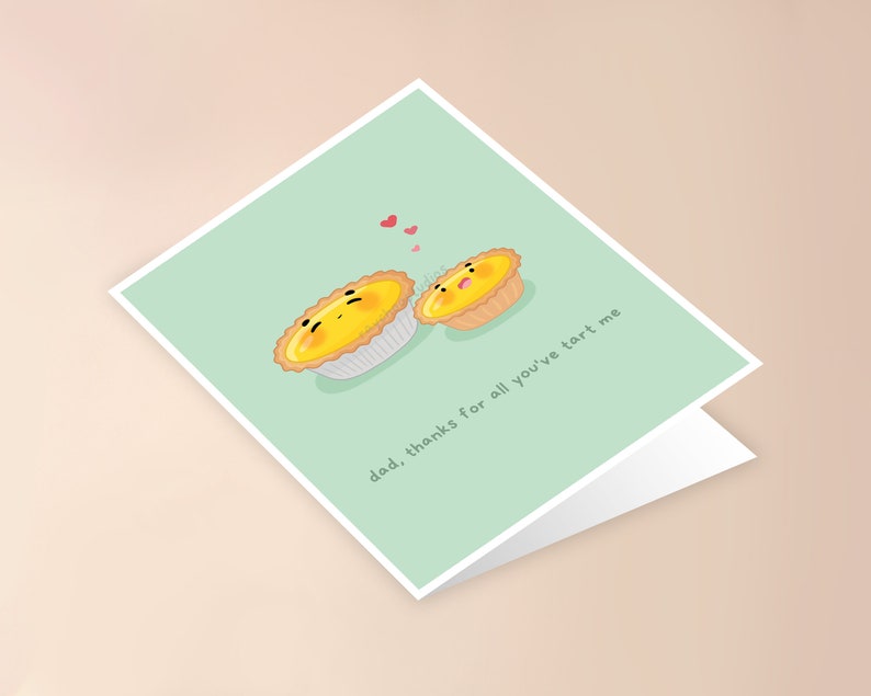 May include: A light green card with two cartoon egg tarts. The larger tart is saying "dad, thanks for all you've tart me". There are three small pink hearts above the tarts.