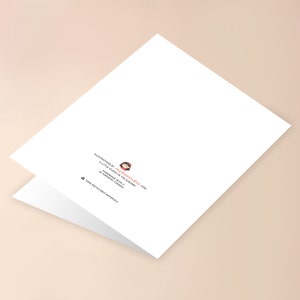 May include: Blank white card with a folded edge. The back of the card has a small illustration of a girl with a red bow and the text "Illustrations by technicolored.com A little studio in the suburbs Handmade with love in Toronto, Canada 100% recyclable materials"