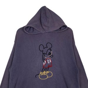 May include: A dark gray hooded sweatshirt with a black and red embroidered Mickey Mouse graphic on the front.