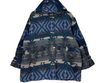 May include: A blue, brown, and beige hooded jacket with a geometric pattern. The jacket has a button closure and pockets.