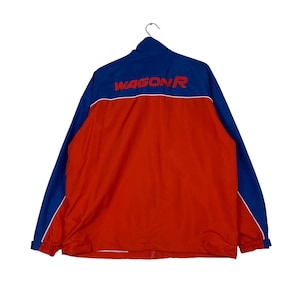 May include: A red and blue windbreaker jacket with the word "WAGON R" in red lettering on the back.