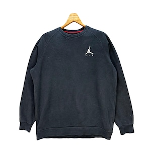 May include: Black sweatshirt with a white Jordan logo and the word "AIR" underneath.