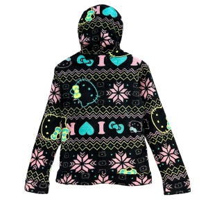 May include: Black fleece hoodie with a colorful pattern featuring Hello Kitty, hearts, and snowflakes. The hoodie has a hood with a drawstring.