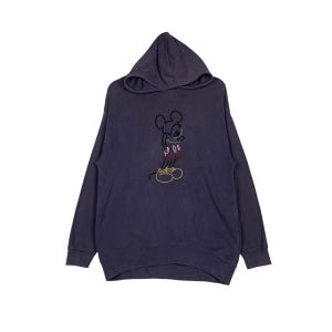 May include: A dark purple hooded sweatshirt with a Mickey Mouse graphic embroidered on the front. The graphic is in black, red, and yellow.