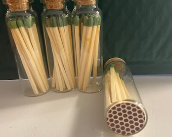 Glass jar w/ 15 matches and striker