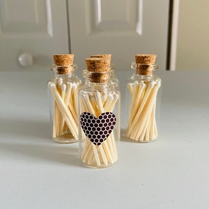 Glass bottle with 20ct White tip matches with heart striker