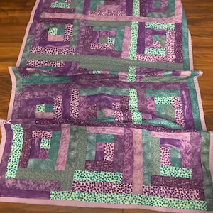 Turquoise And purple log cabin quilt