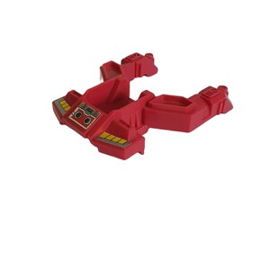 May include: Red plastic toy spaceship with a cockpit and two wings. The spaceship has yellow and black details.