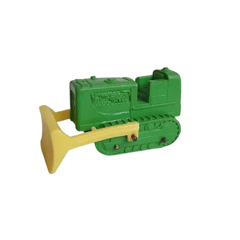 May include: Green toy bulldozer with a yellow blade. The bulldozer has a detailed cab and tracks.