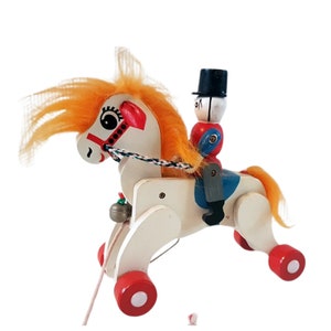 Vintage wooden pull horse with soldier